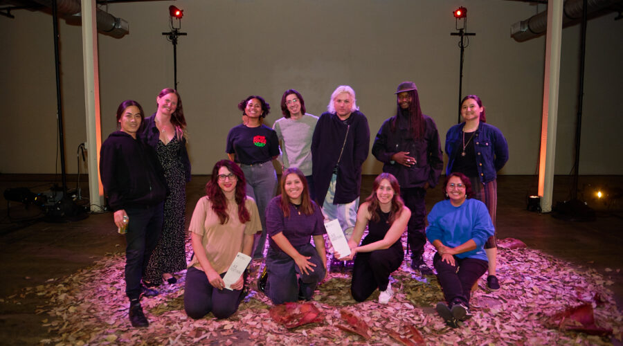 Image of 11 people surrounded by leaves